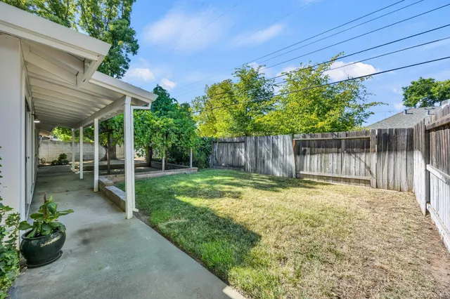 an aerial view of a house with pool