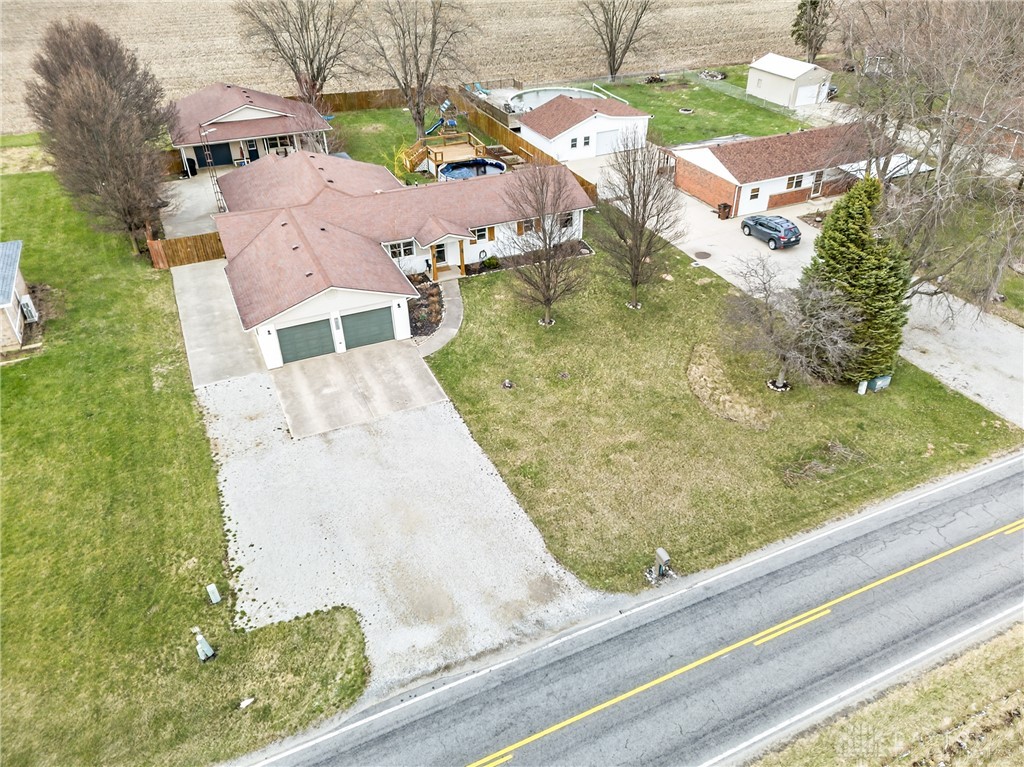 7888 Darke-Preble County Line Road Arcanum, OH 45304 - Photo 2 of 51 This expansive property offers a private yard with ample space and a convenient attached garage.