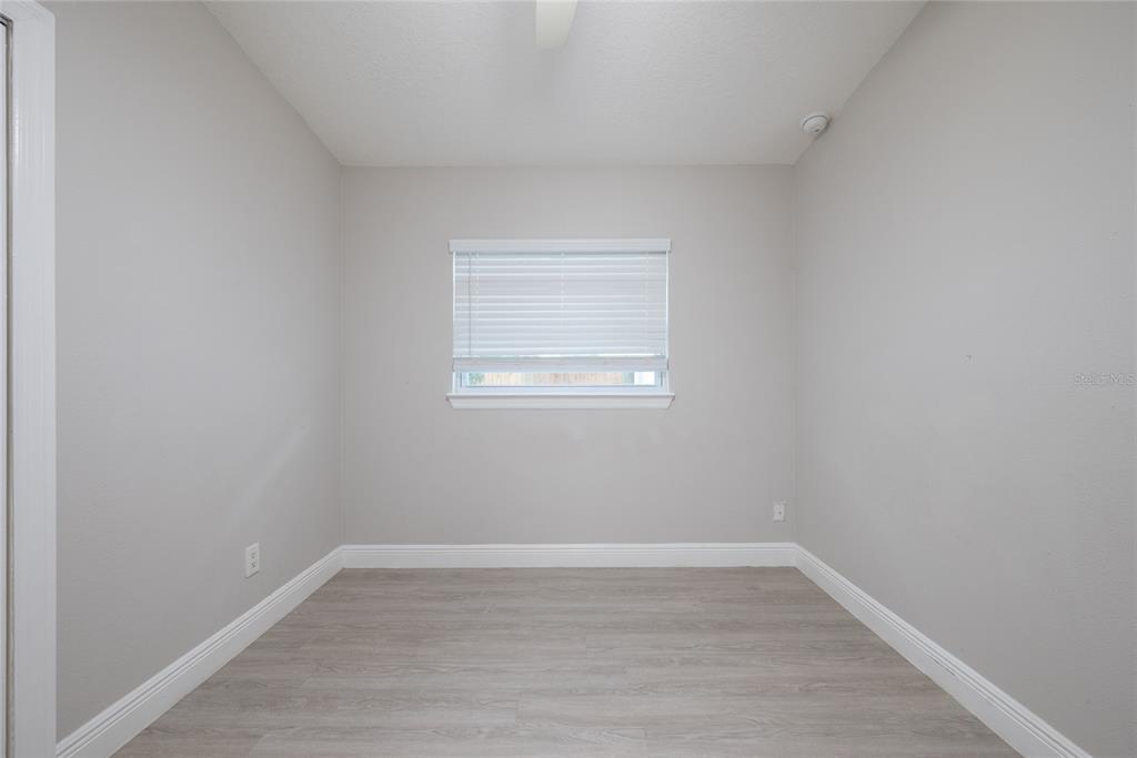 291 Ivey Road Casselberry, FL 32707 - Photo 23 of 32 a view of a small space with wooden floor and a window