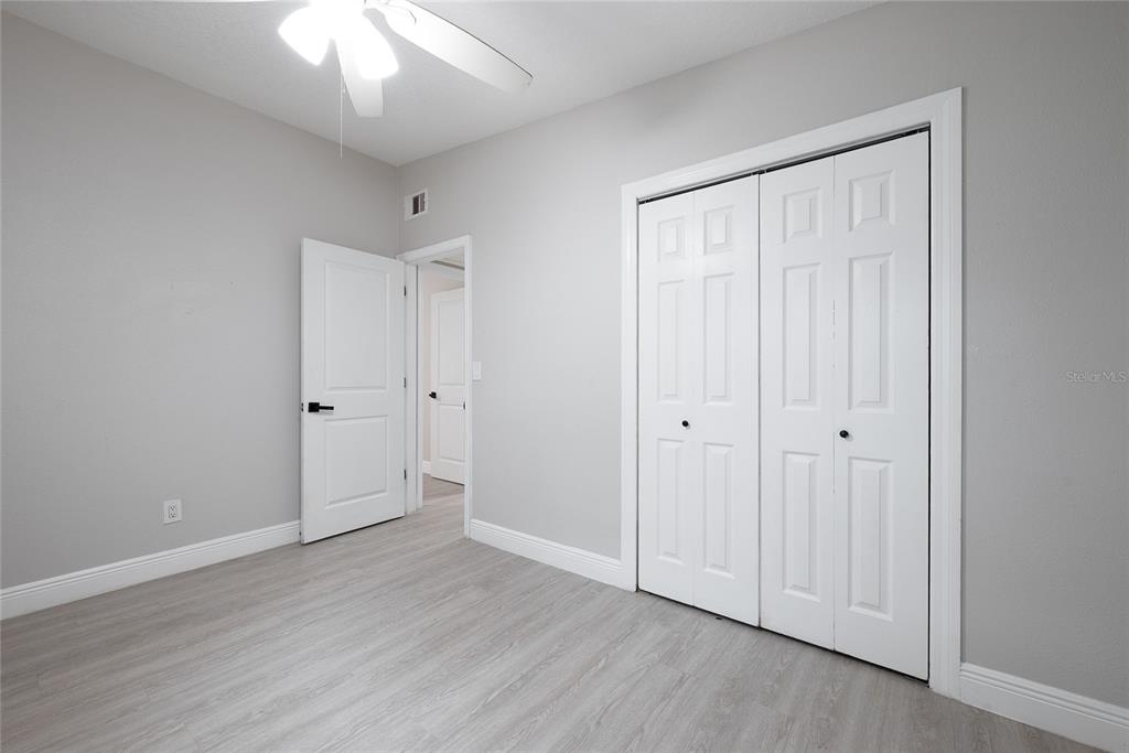 291 Ivey Road Casselberry, FL 32707 - Photo 32 of 32 a view of an empty room with wooden floor