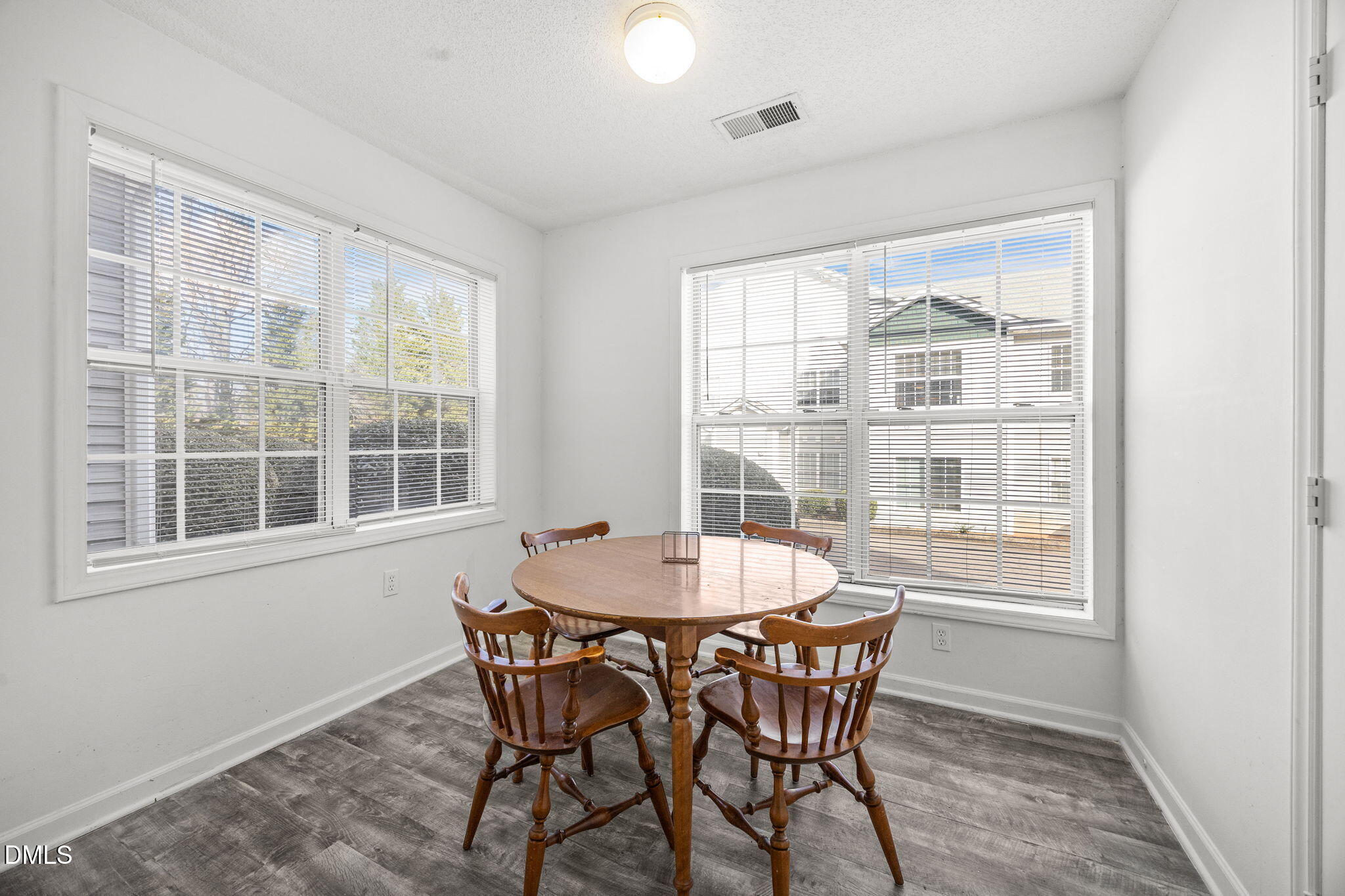1305 Kent Road, Unit 101 Raleigh, NC 27606 - Photo 6 of 29 a dining room with furniture and window