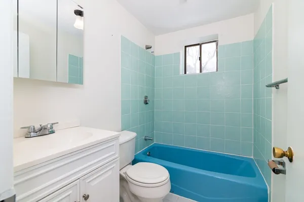 a bathroom with a sink a toilet and a bathtub