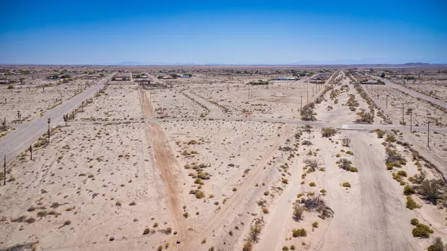 a view of a road with a building in the background