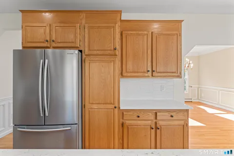 a view of a refrigerator in kitchen