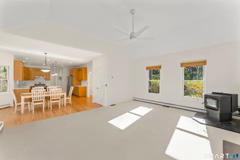a view of a livingroom with furniture window and wooden floor