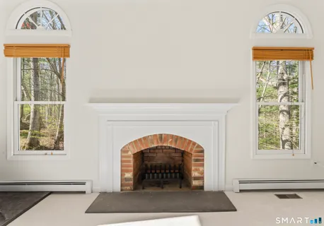 a view of an entryway with a fireplace