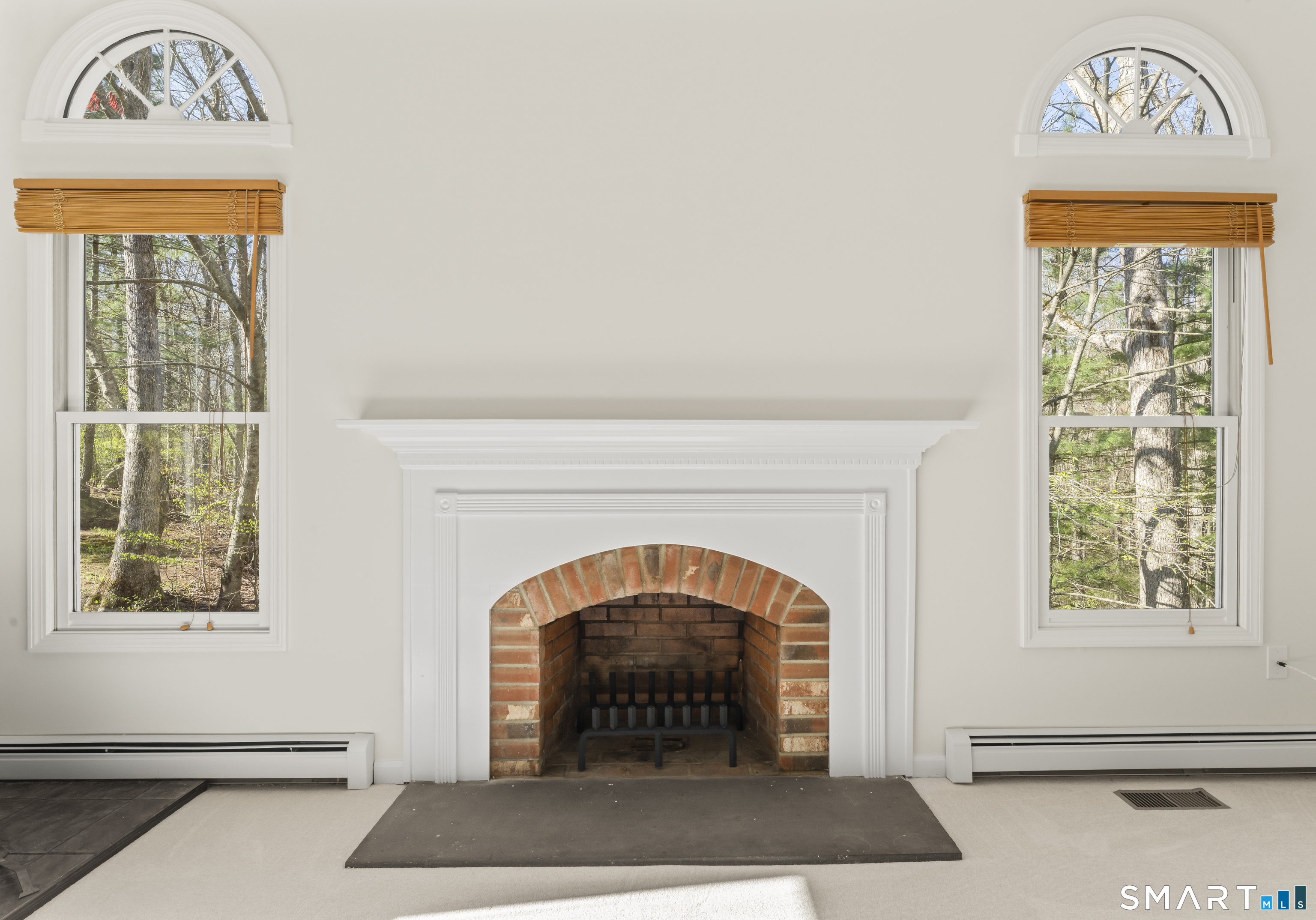 5 Beagle Trail Newtown, CT 06482 - Photo 21 of 40 a view of an entryway with a fireplace