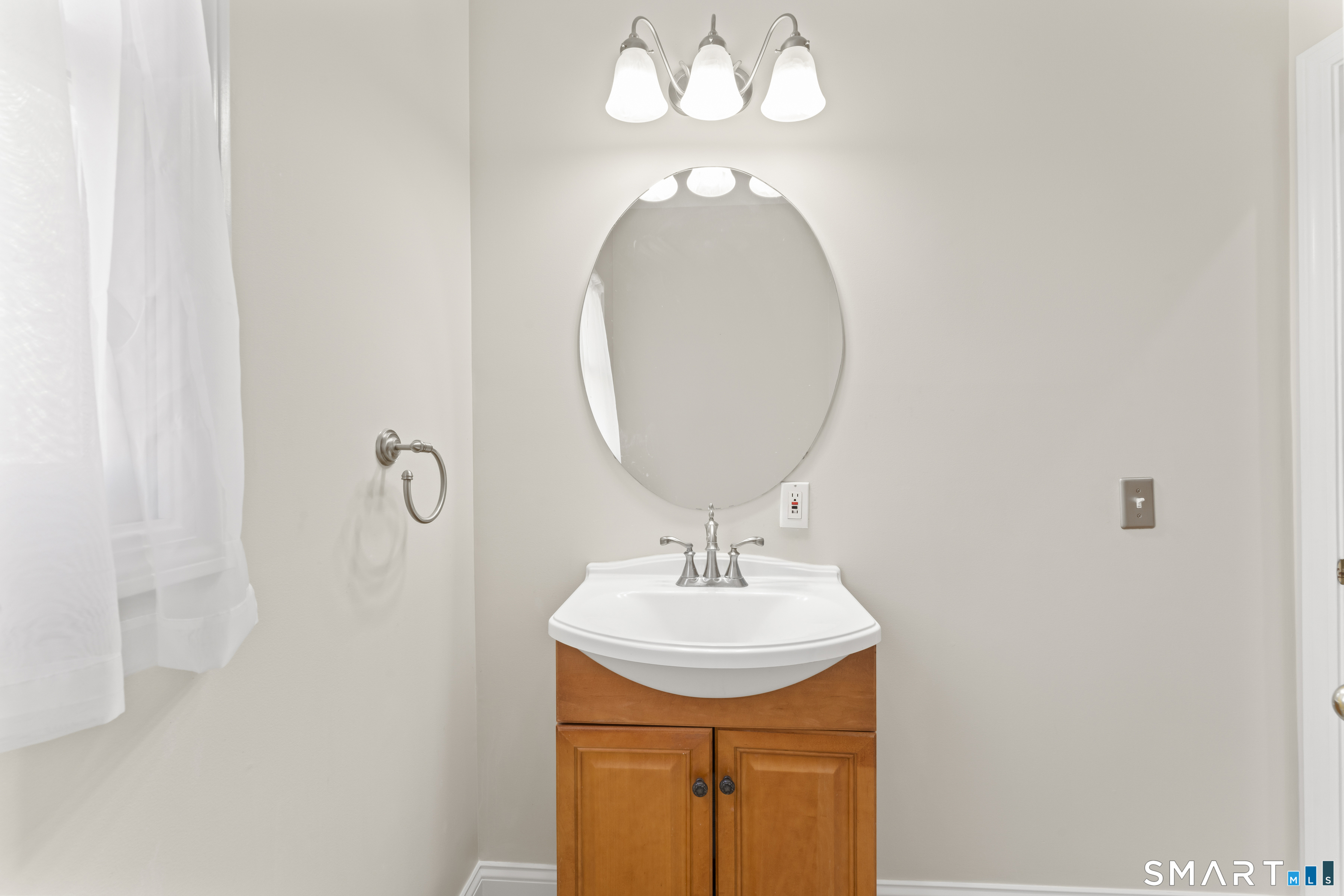 5 Beagle Trail Newtown, CT 06482 - Photo 23 of 40 a bathroom with a sink and a mirror
