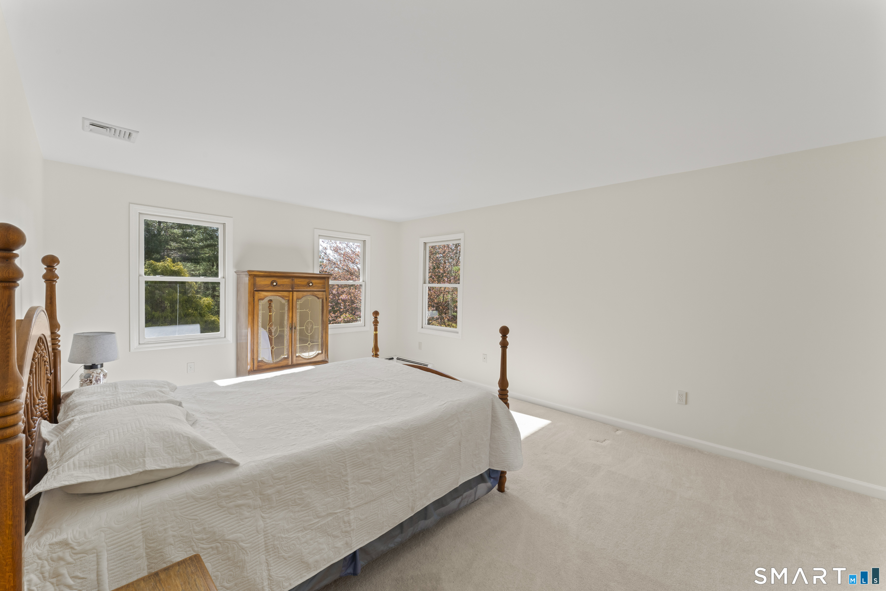 5 Beagle Trail Newtown, CT 06482 - Photo 26 of 40 a bedroom with a bed and large window