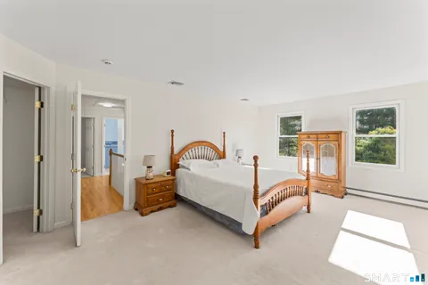 a bed room with a bed and a large window
