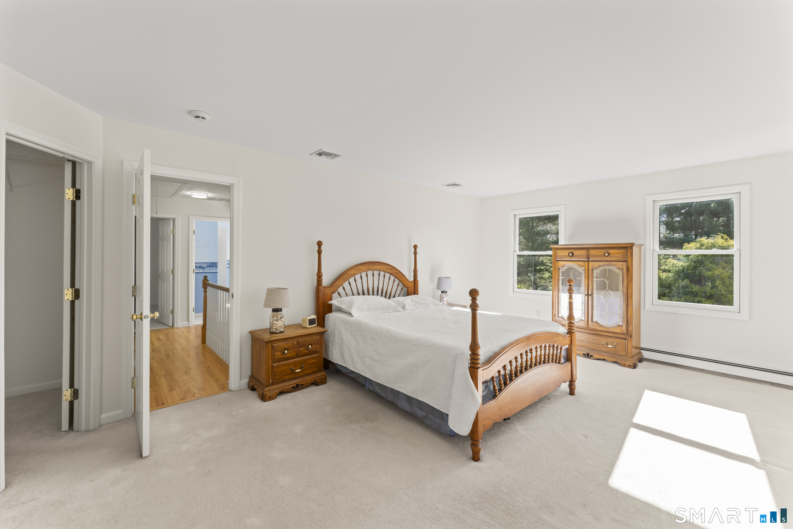 5 Beagle Trail Newtown, CT 06482 - Photo 27 of 40 a bed room with a bed and a large window