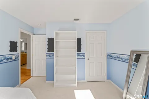 a view of a kitchen with refrigerator and cabinet