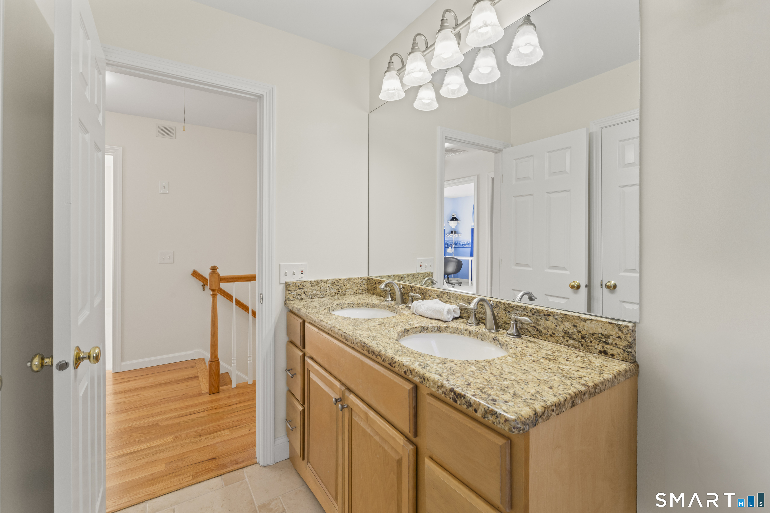 5 Beagle Trail Newtown, CT 06482 - Photo 38 of 40 a bathroom with a granite countertop sink and a mirror