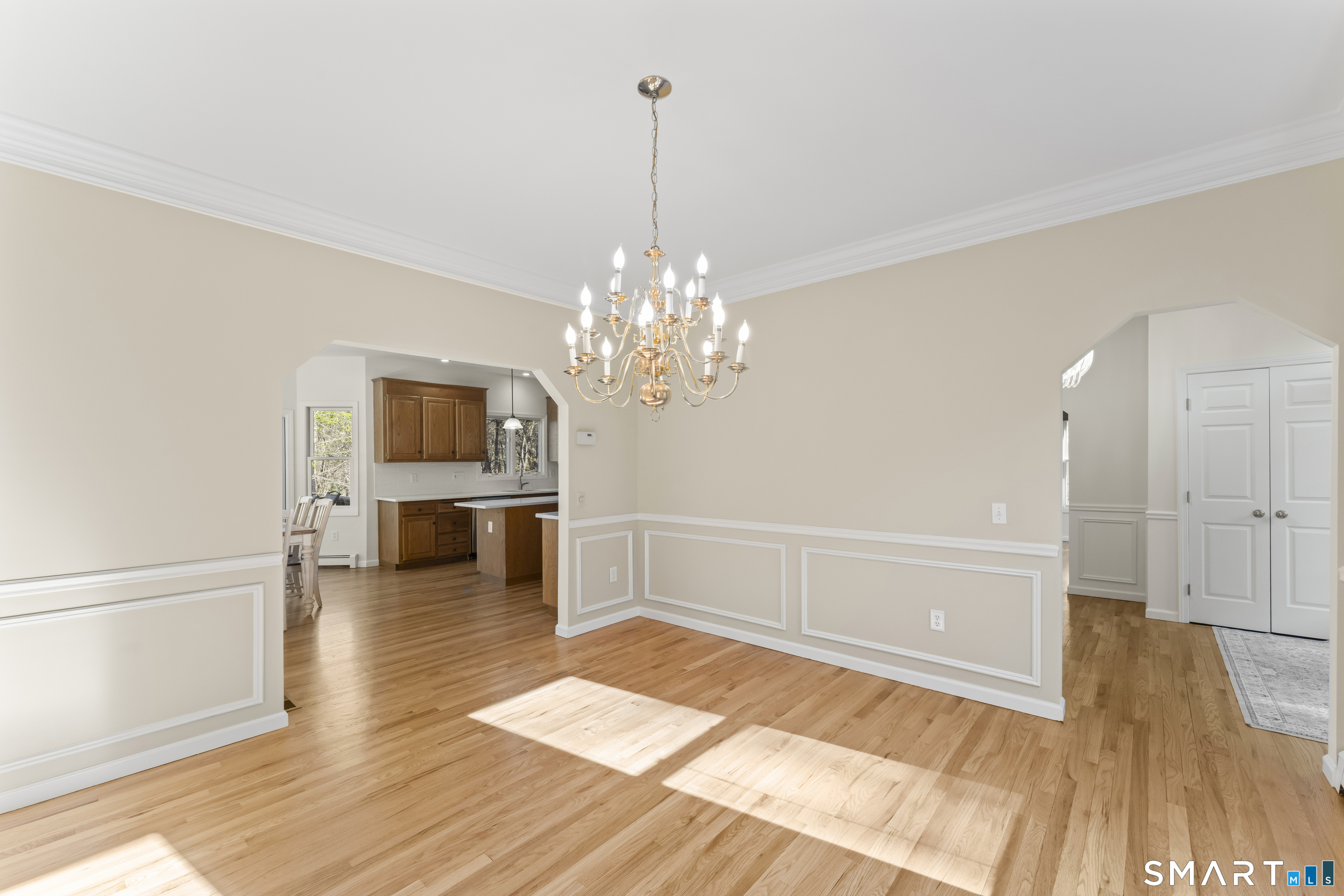 5 Beagle Trail Newtown, CT 06482 - Photo 7 of 40 a view of a livingroom with a furniture wooden floor and chandelier
