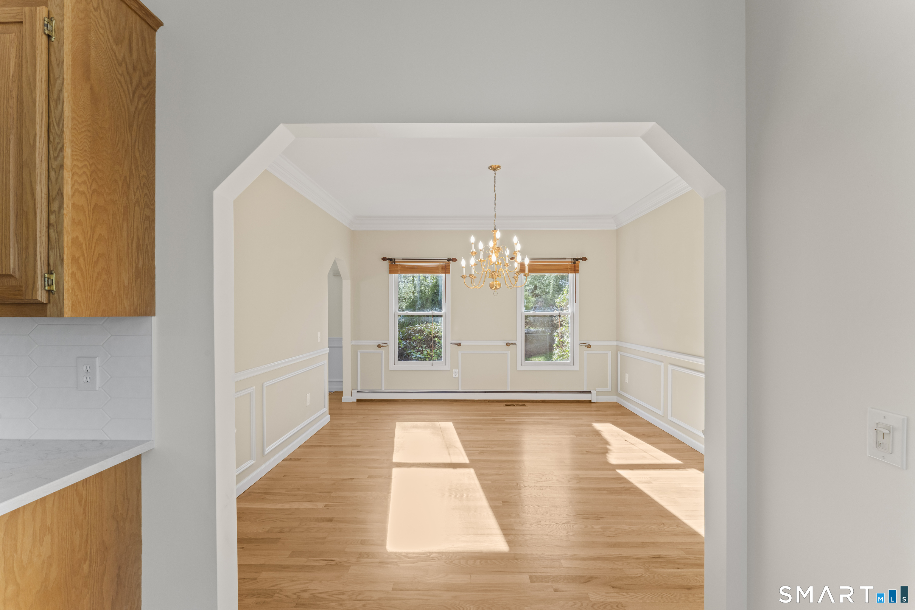 5 Beagle Trail Newtown, CT 06482 - Photo 9 of 40 a view of a room with a window and chandelier
