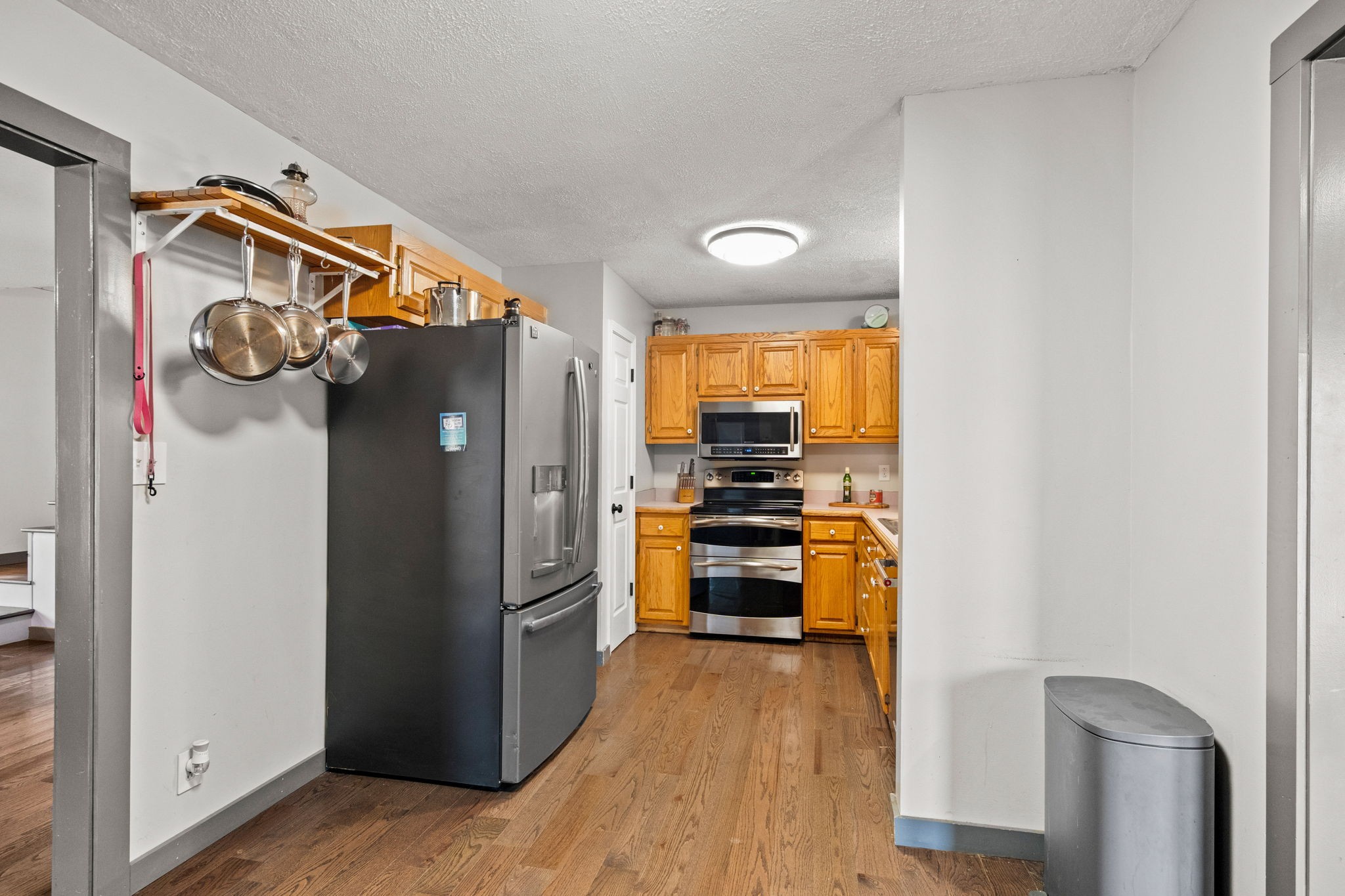 6117 Henry Gower Road Pleasant View, TN 37146 - Photo 11 of 61 a kitchen with stainless steel appliances a refrigerator and a stove top oven