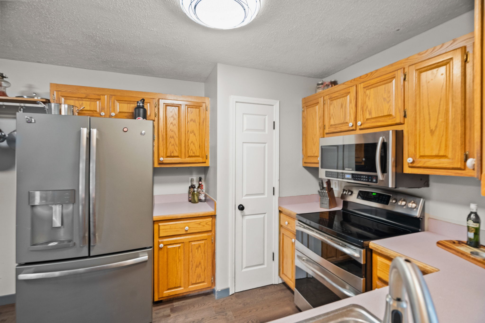 6117 Henry Gower Road Pleasant View, TN 37146 - Photo 13 of 61 a kitchen with stainless steel appliances a refrigerator stove and microwave