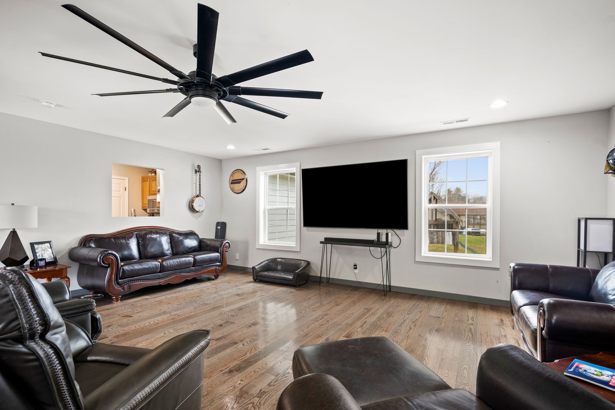 6117 Henry Gower Road Pleasant View, TN 37146 - Photo 16 of 61 a living room with furniture and a flat screen tv