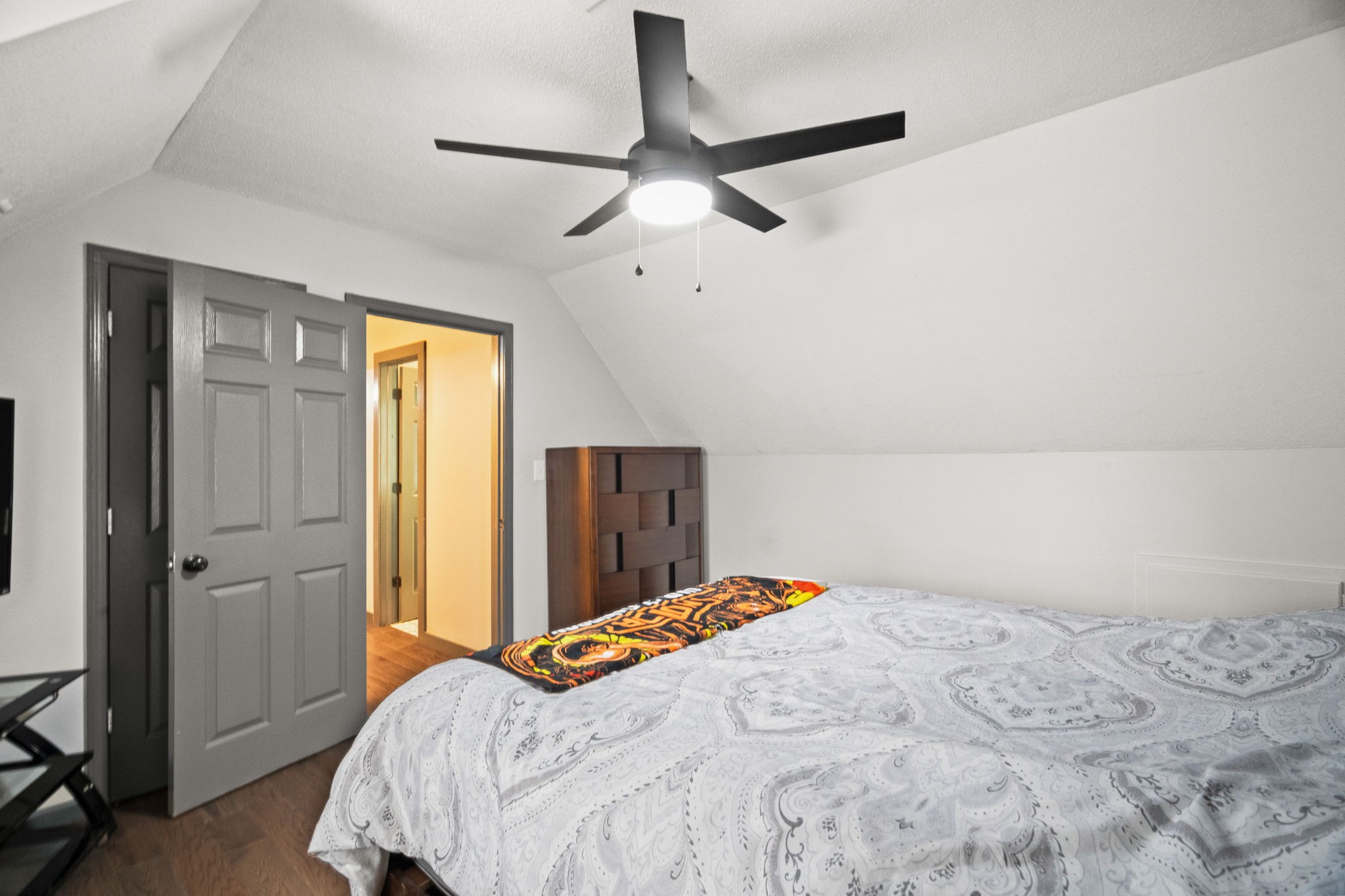 6117 Henry Gower Road Pleasant View, TN 37146 - Photo 30 of 61 a bedroom with a bed and a chandelier