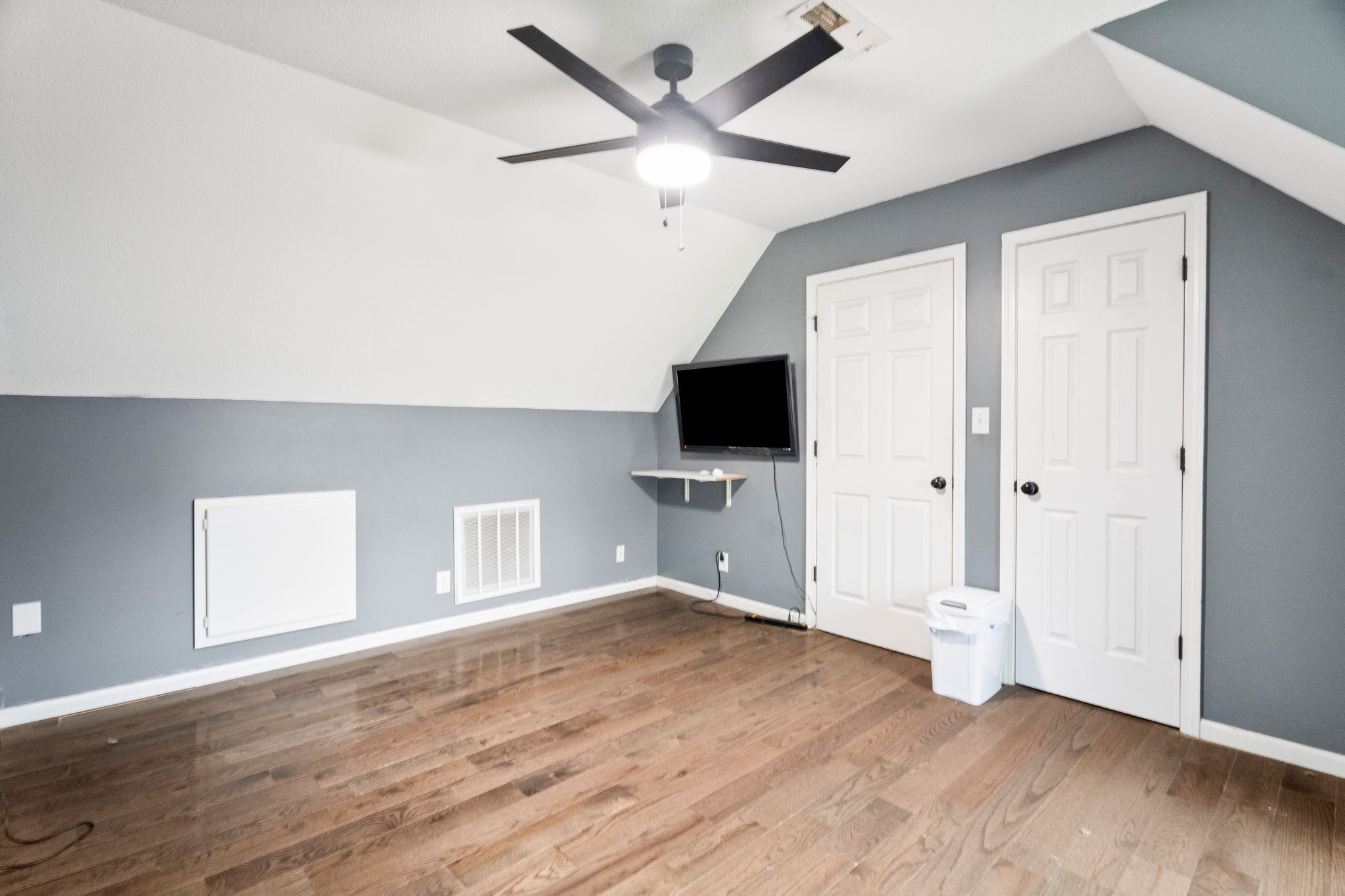 6117 Henry Gower Road Pleasant View, TN 37146 - Photo 33 of 61 an empty room with wooden floor and ceiling fan