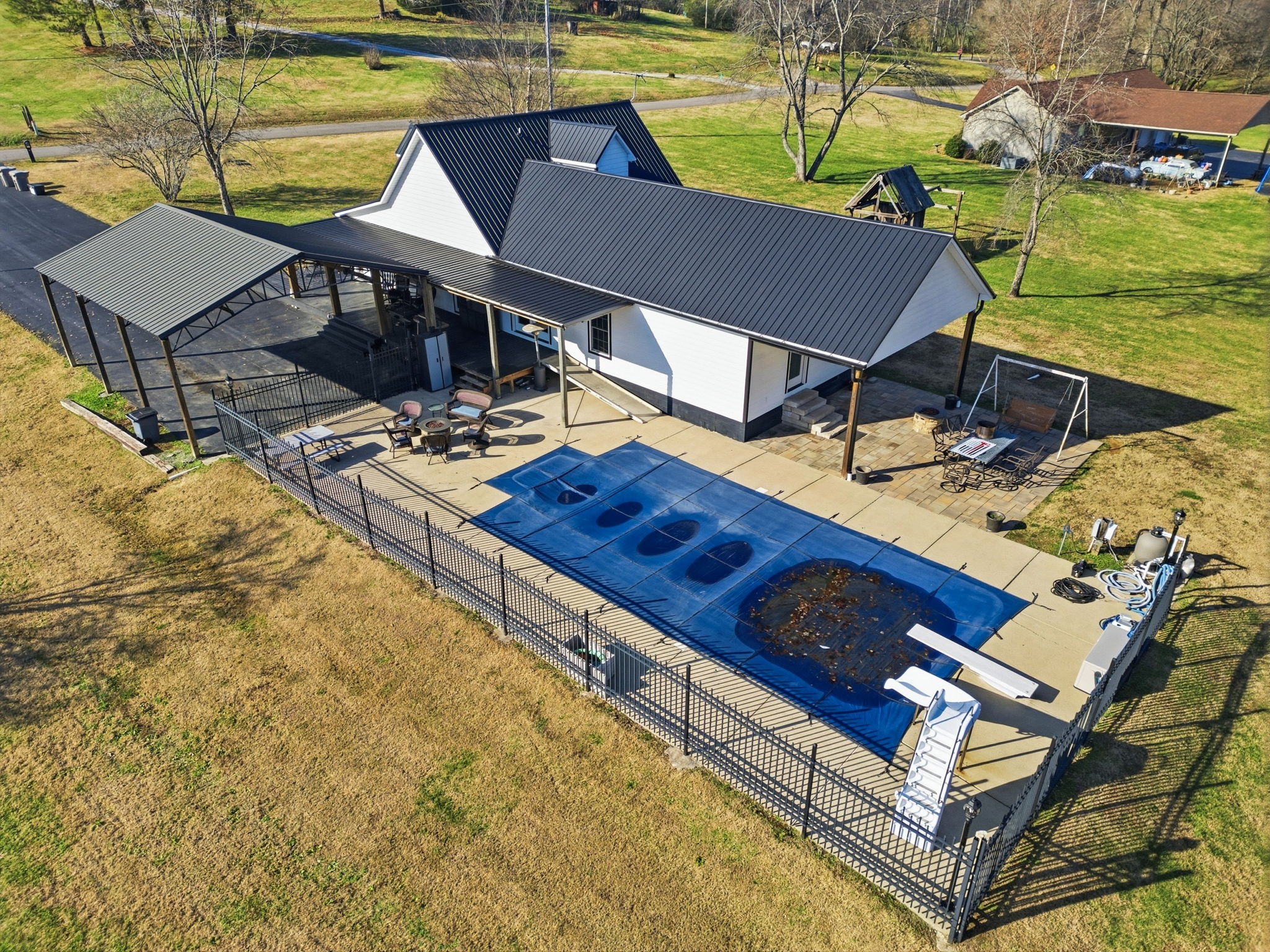 6117 Henry Gower Road Pleasant View, TN 37146 - Photo 34 of 61 a view of a swimming pool with a lounge chairs