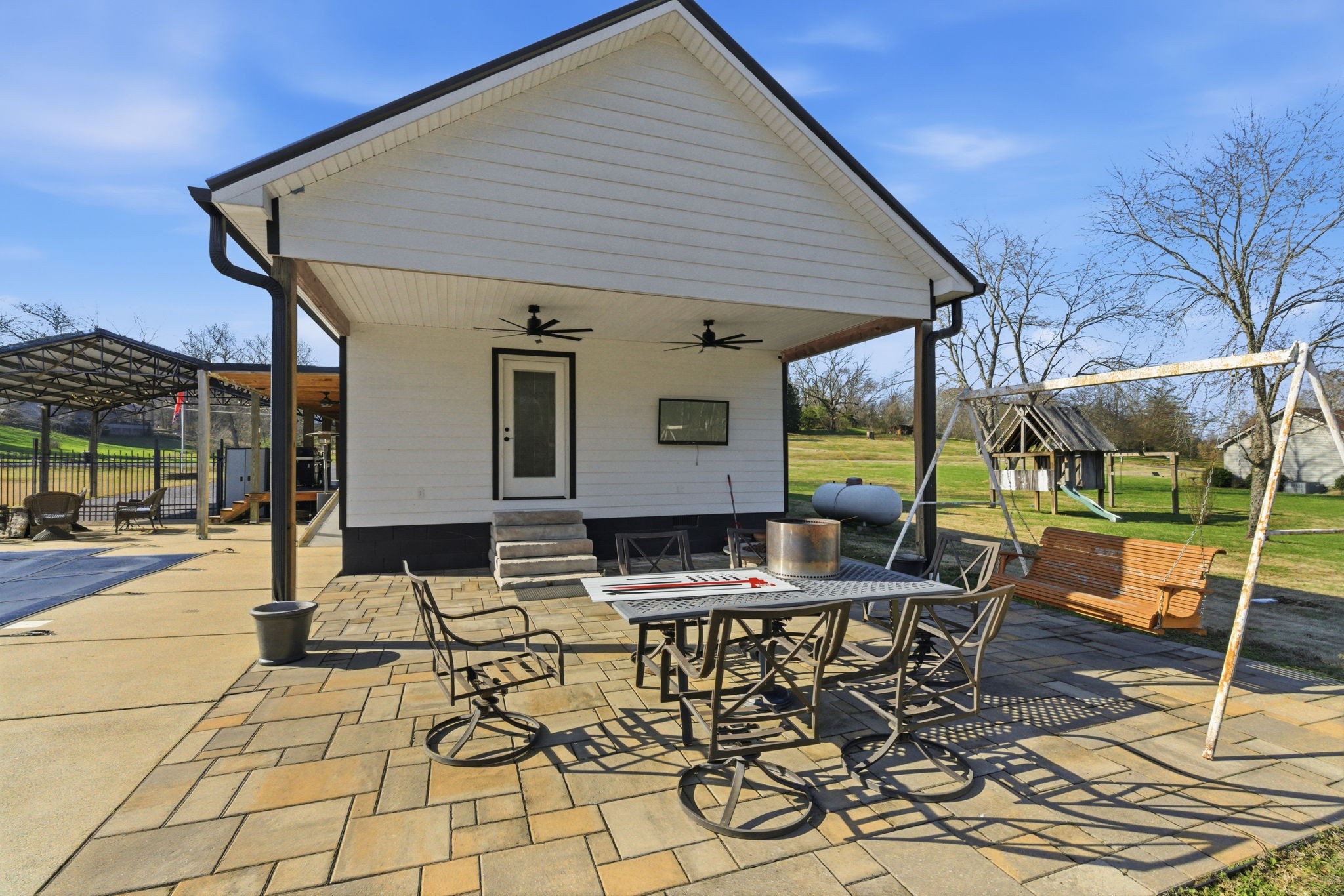 6117 Henry Gower Road Pleasant View, TN 37146 - Photo 37 of 61 a patio with glass top table and chairs