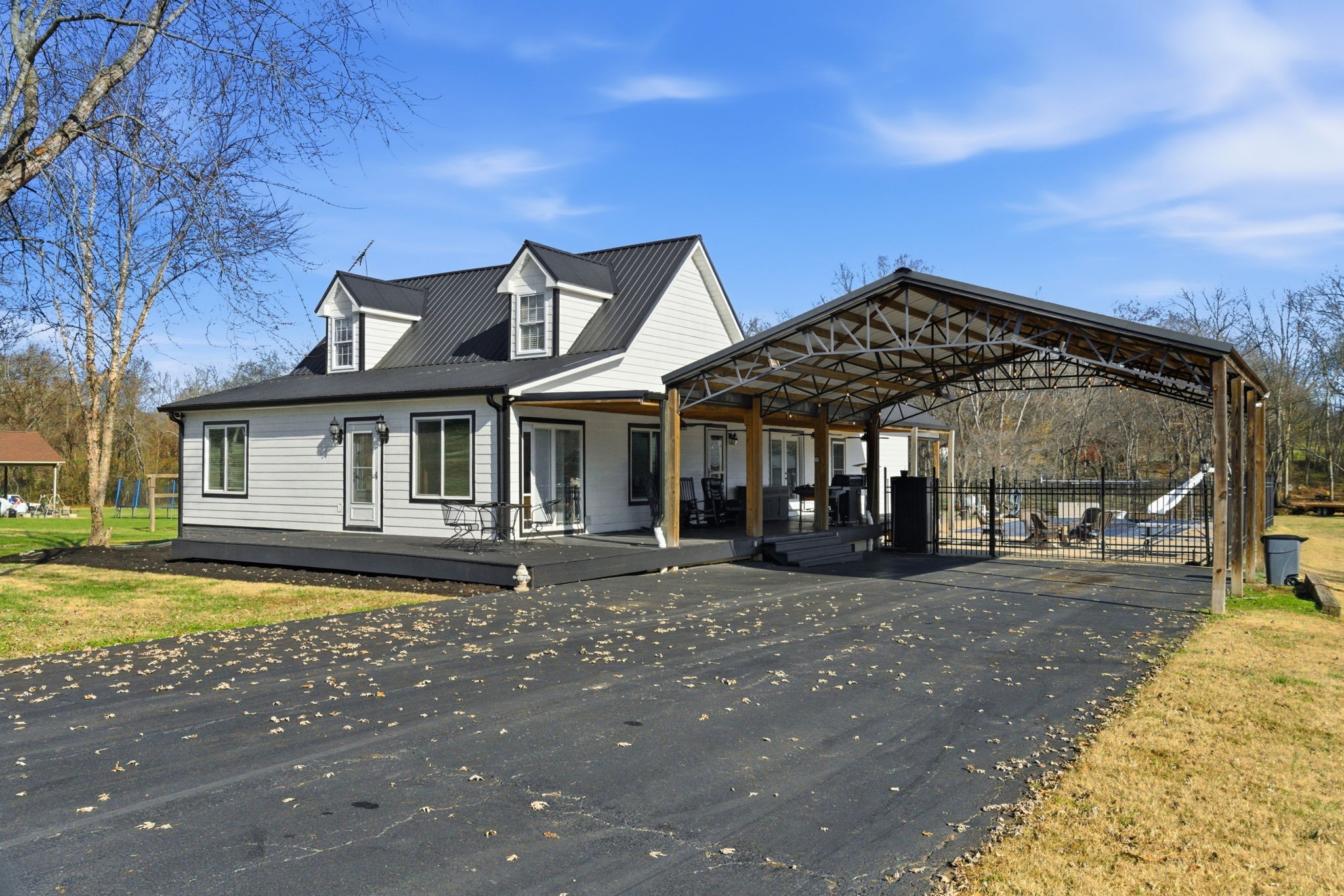 6117 Henry Gower Road Pleasant View, TN 37146 - Photo 48 of 61 a front view of a house with swimming pool having outdoor seating