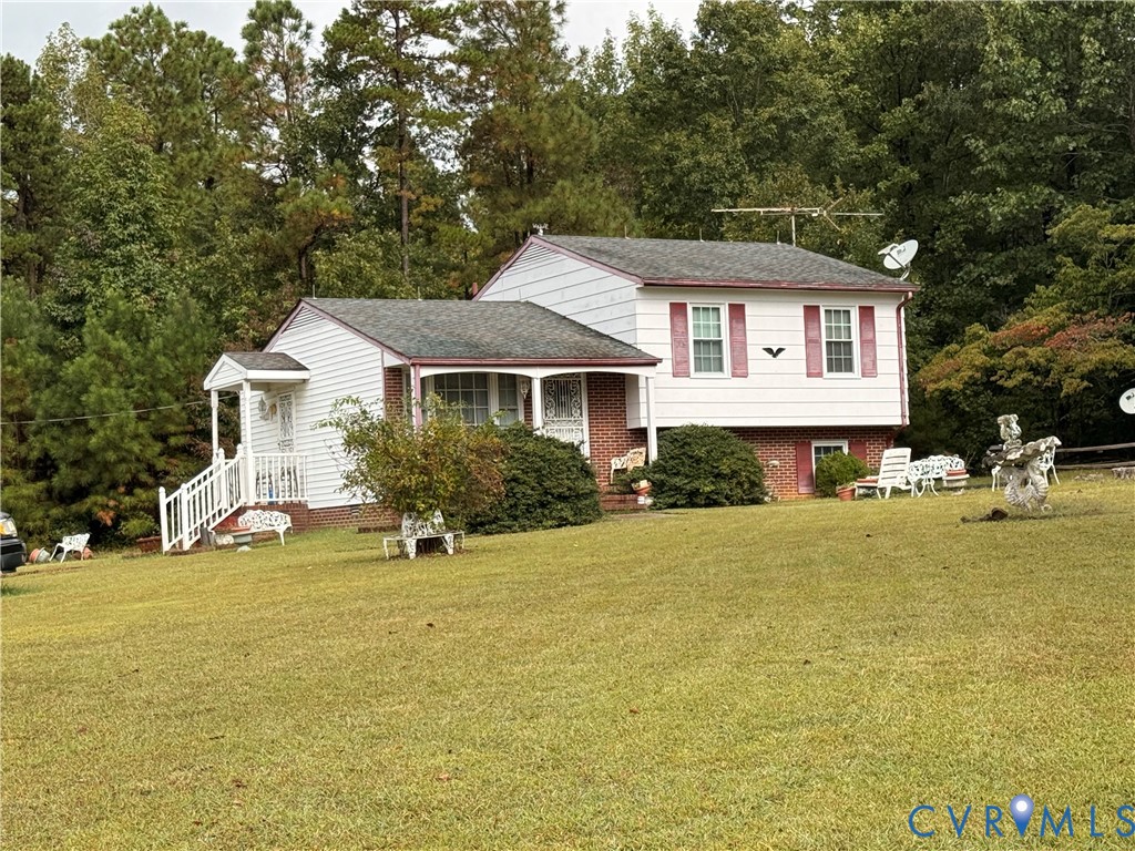 1455 Indian Oak Road Crewe, VA 23930 - Photo 2 of 3 a front view of a house with yard and trees