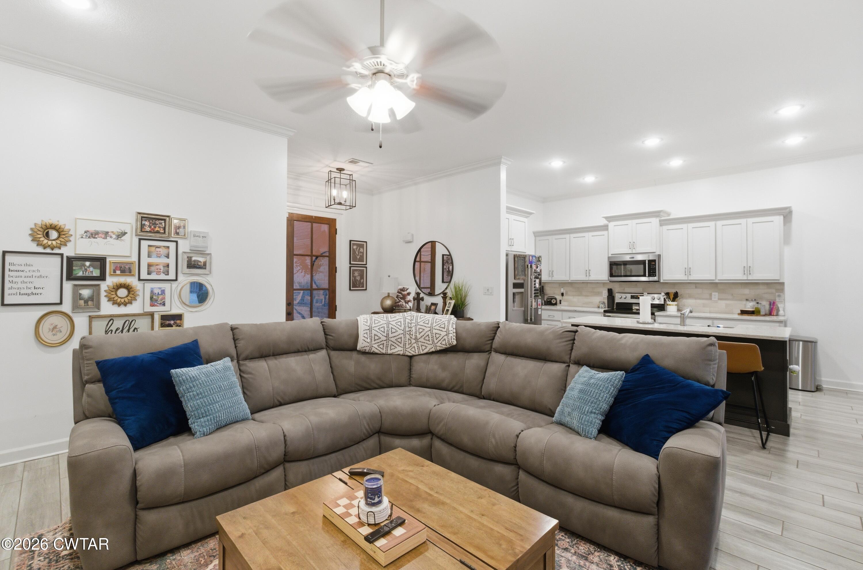 5 Pinehill Cove Jackson, TN 38305 - Photo 12 of 47 a living room with furniture kitchen view and a chandelier
