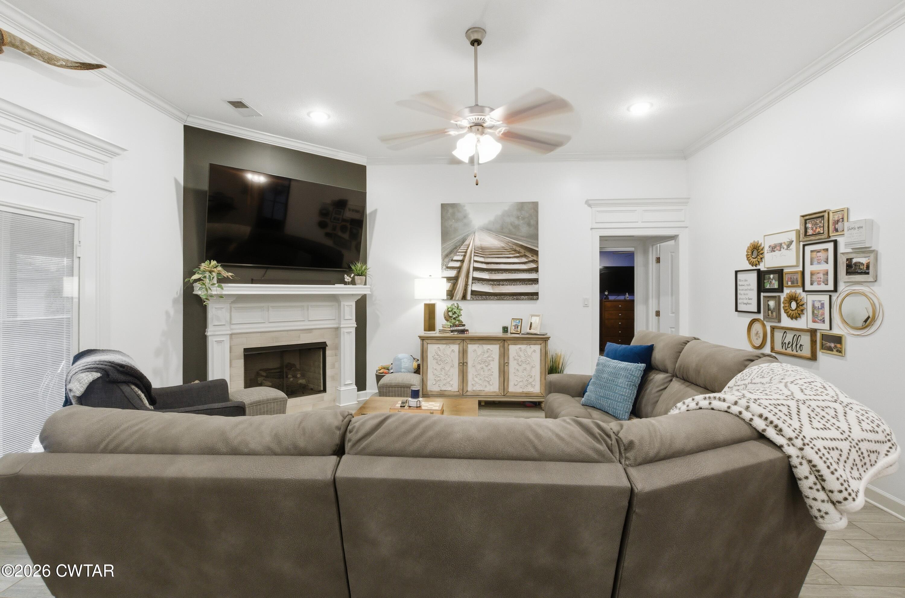 5 Pinehill Cove Jackson, TN 38305 - Photo 14 of 47 a living room with furniture and a flat screen tv