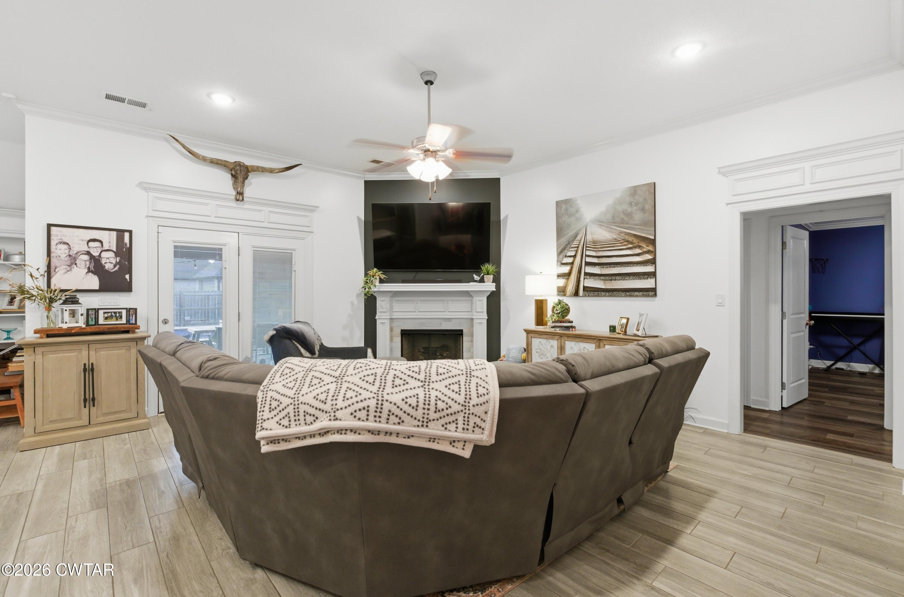 5 Pinehill Cove Jackson, TN 38305 - Photo 15 of 47 a living room with furniture a flat screen tv and a fireplace