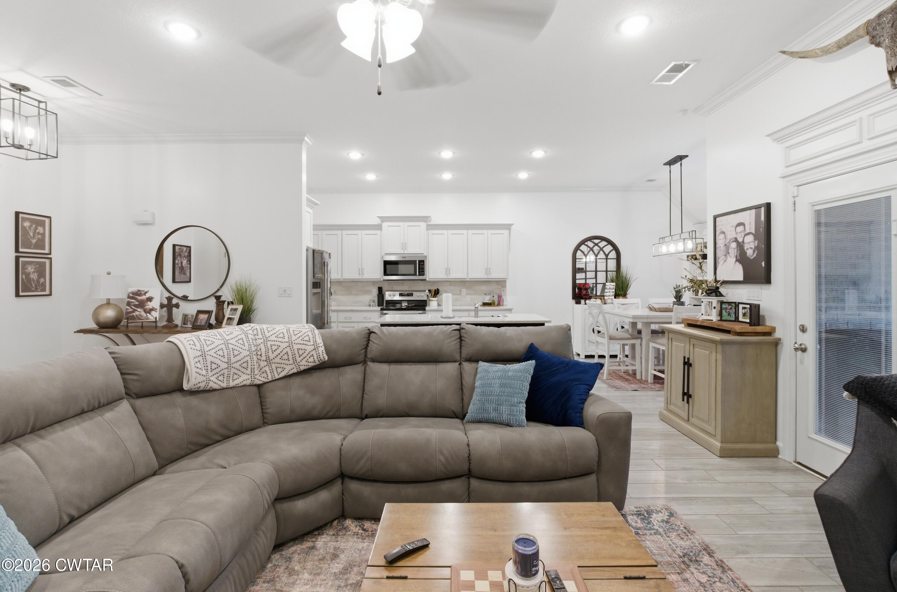 5 Pinehill Cove Jackson, TN 38305 - Photo 16 of 47 a living room with furniture kitchen view and a chandelier