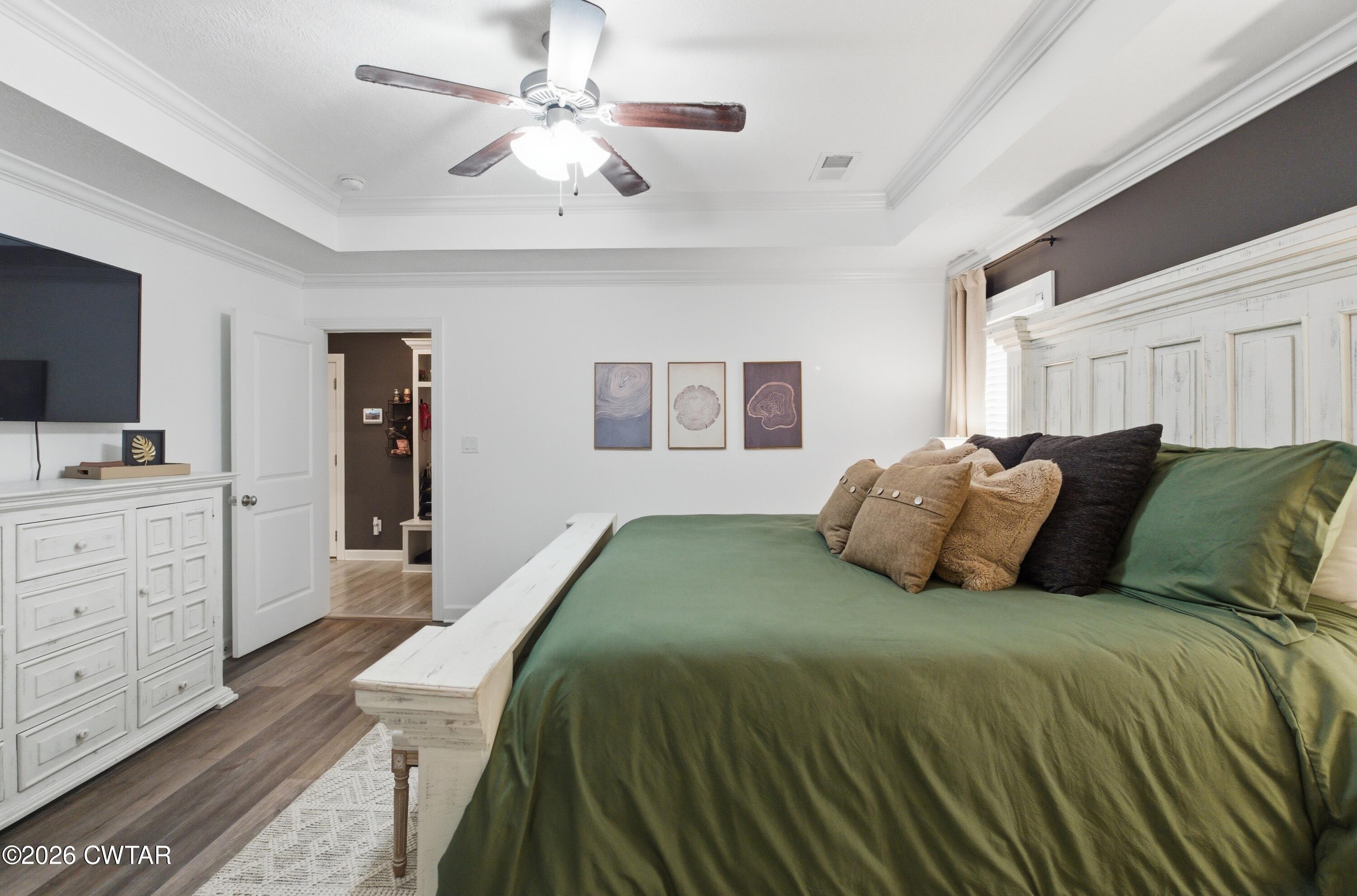 5 Pinehill Cove Jackson, TN 38305 - Photo 18 of 47 a bedroom with a large bed and a flat screen tv