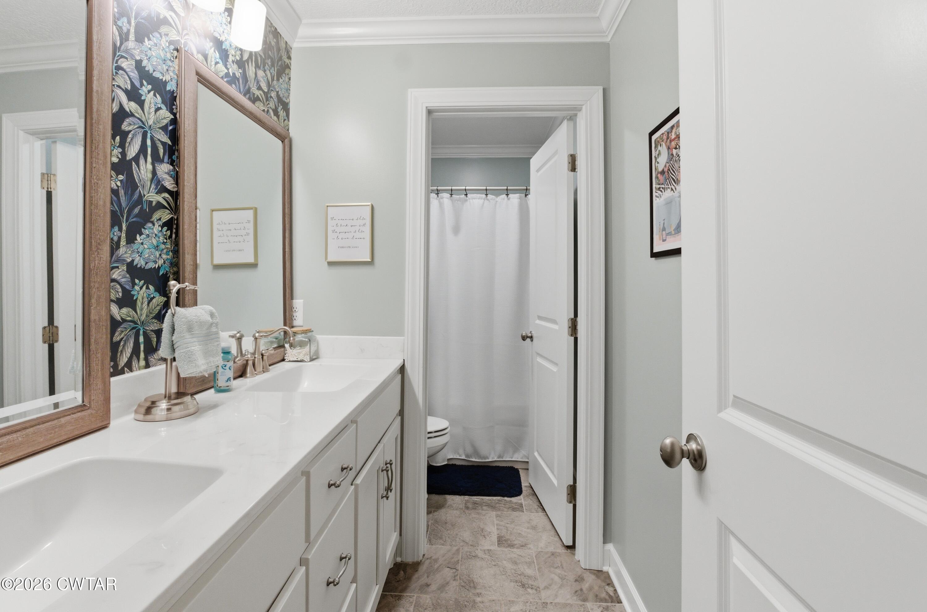 5 Pinehill Cove Jackson, TN 38305 - Photo 29 of 47 a bathroom with a double vanity sink and mirror