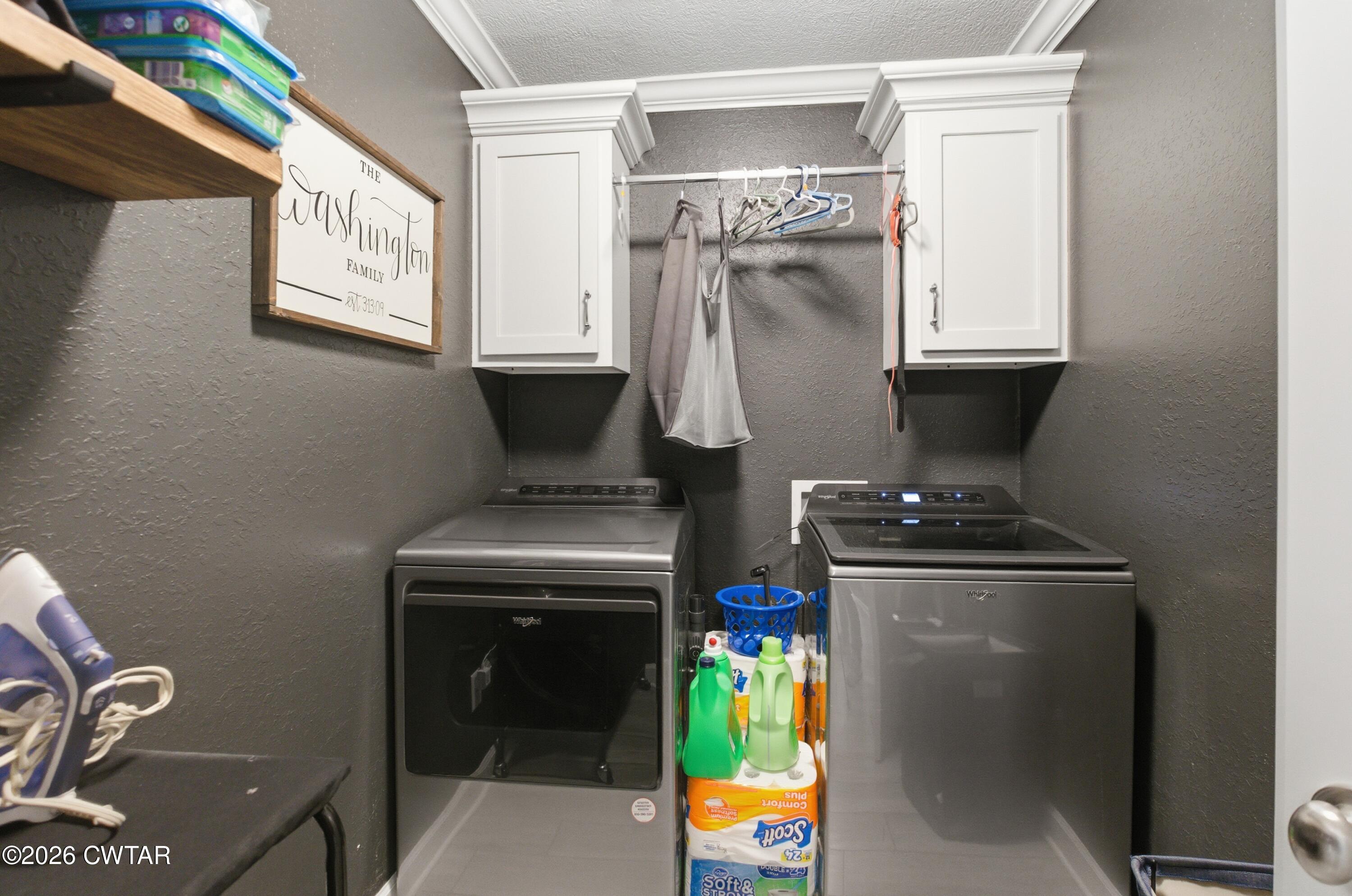 5 Pinehill Cove Jackson, TN 38305 - Photo 32 of 47 a utility room with dryer and washer