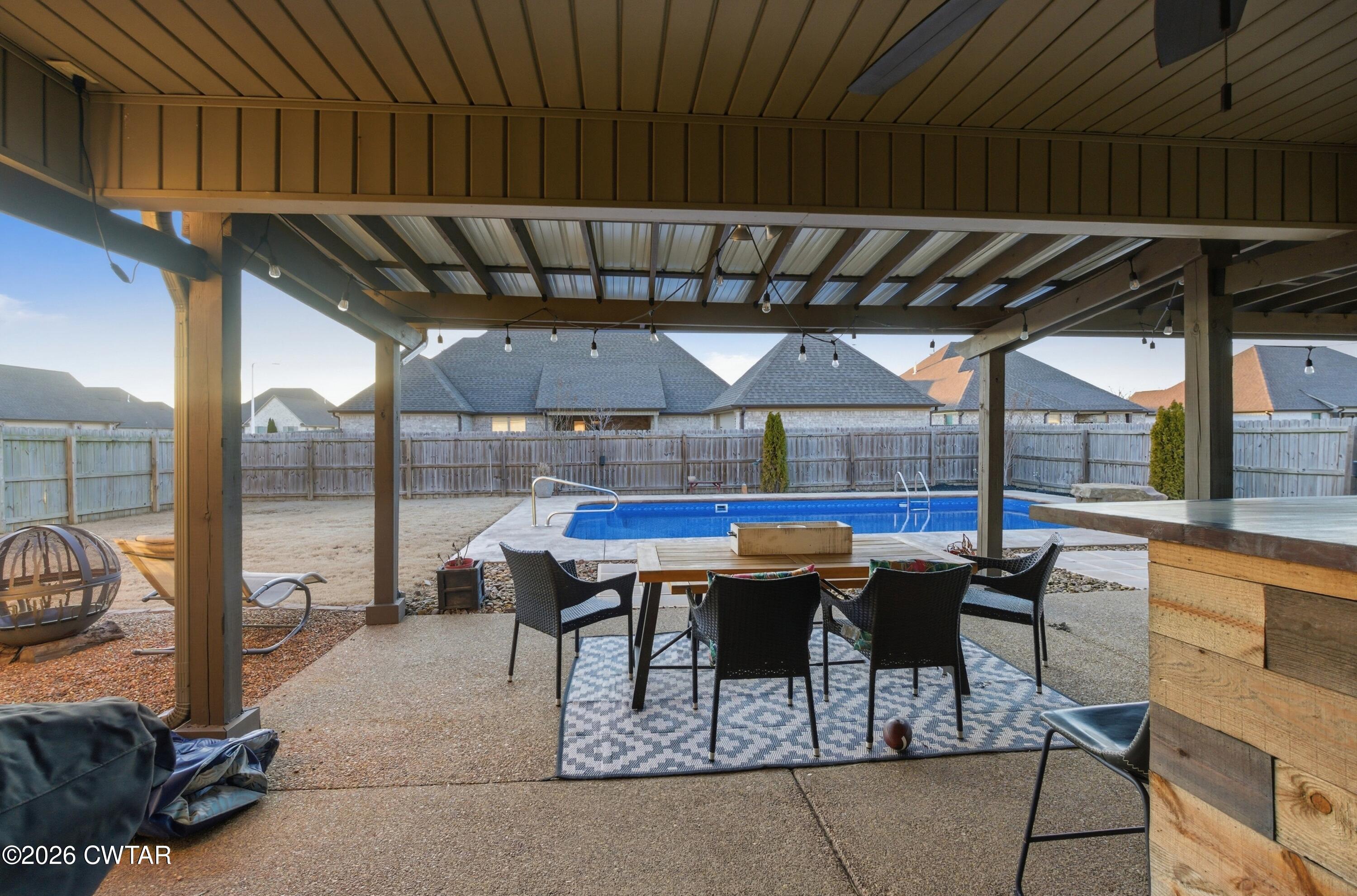 5 Pinehill Cove Jackson, TN 38305 - Photo 35 of 47 a patio with table and chairs