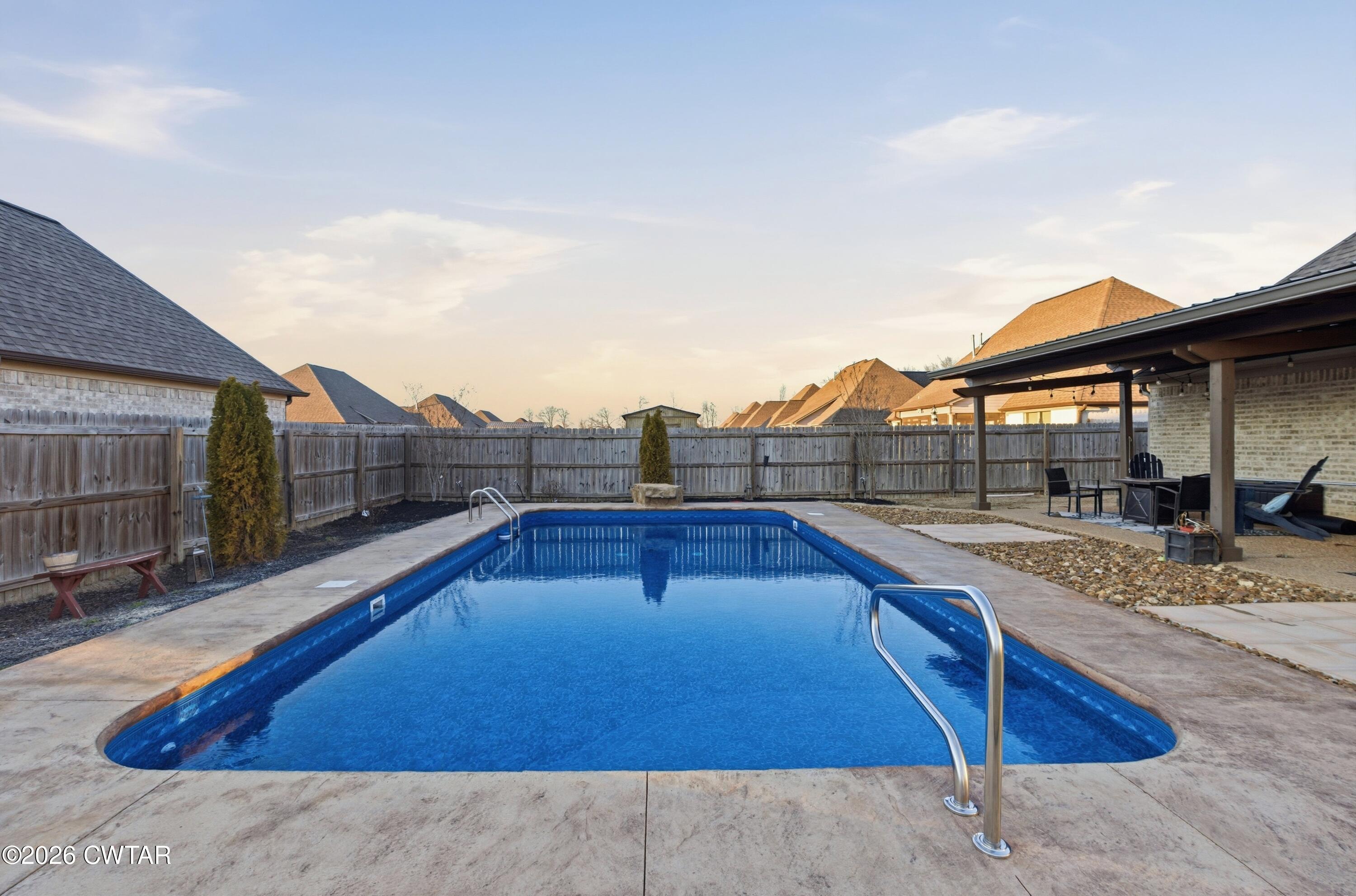 5 Pinehill Cove Jackson, TN 38305 - Photo 37 of 47 a view of a swimming pool with a lounge chairs