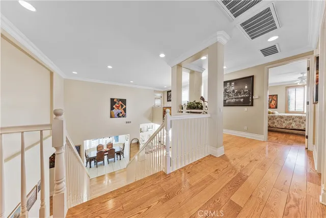 a large bathroom with a large mirror vanity and shower