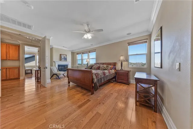 a bedroom with a bed and glass walk in closet