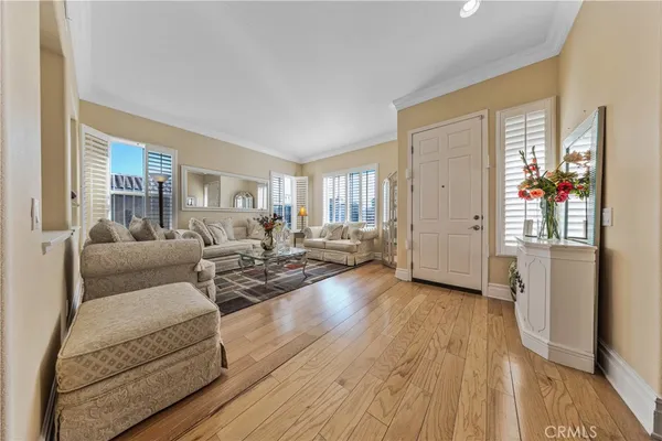 a kitchen with stainless steel appliances granite countertop a sink refrigerator and cabinets