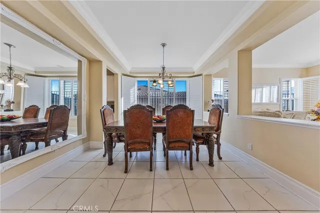 a kitchen with stainless steel appliances granite countertop a sink refrigerator and cabinets