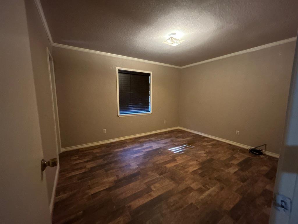 928 Vz County Road 3828 Wills Point, TX 75169 - Photo 14 of 29 an empty room with wooden floor and windows