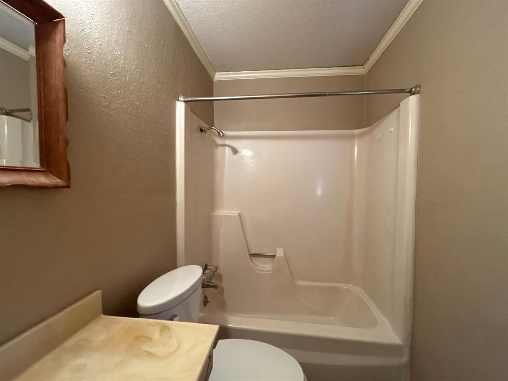 928 Vz County Road 3828 Wills Point, TX 75169 - Photo 15 of 29 a bathroom with a shower and a toilet
