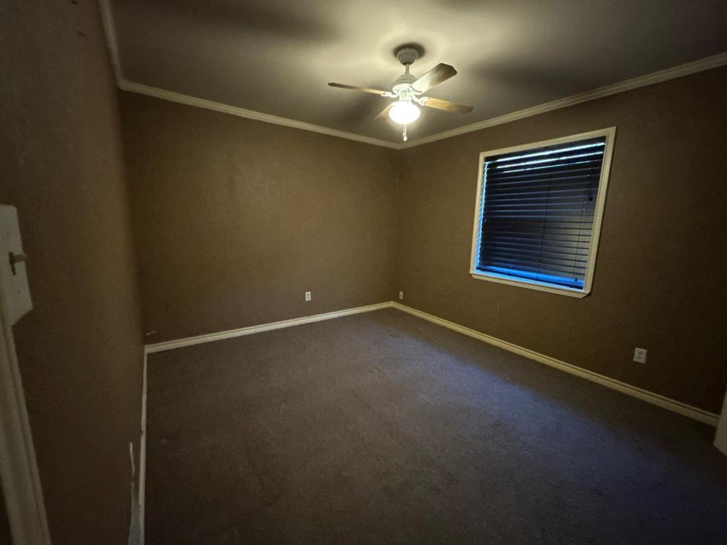 928 Vz County Road 3828 Wills Point, TX 75169 - Photo 17 of 29 en empty room with windows and chandelier fan