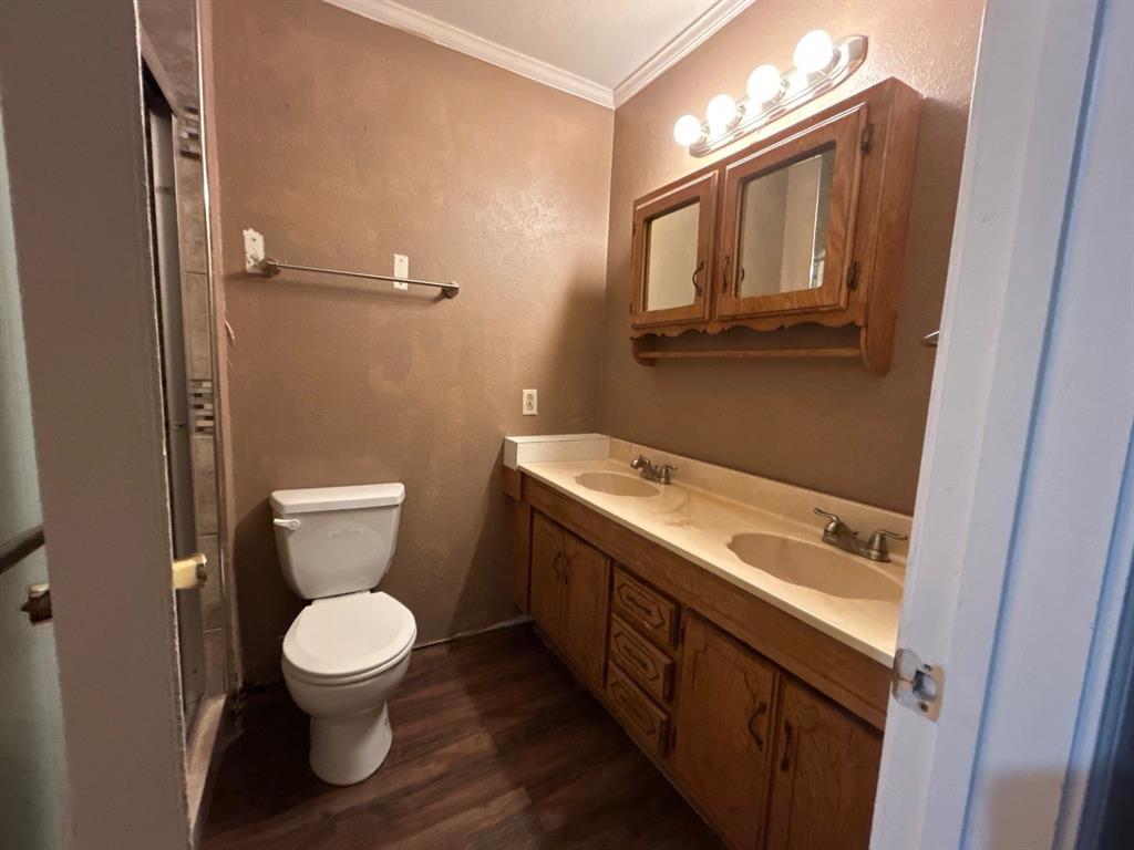 928 Vz County Road 3828 Wills Point, TX 75169 - Photo 21 of 29 a bathroom with a toilet sink and mirror