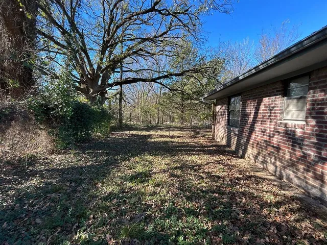a view of backyard with green space