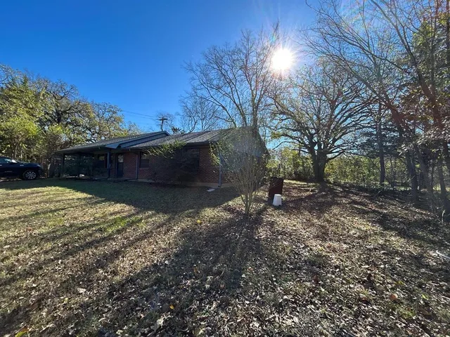 a backyard of a house with lots of green space
