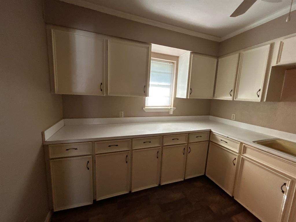 928 Vz County Road 3828 Wills Point, TX 75169 - Photo 8 of 29 a kitchen with a sink cabinets and a window