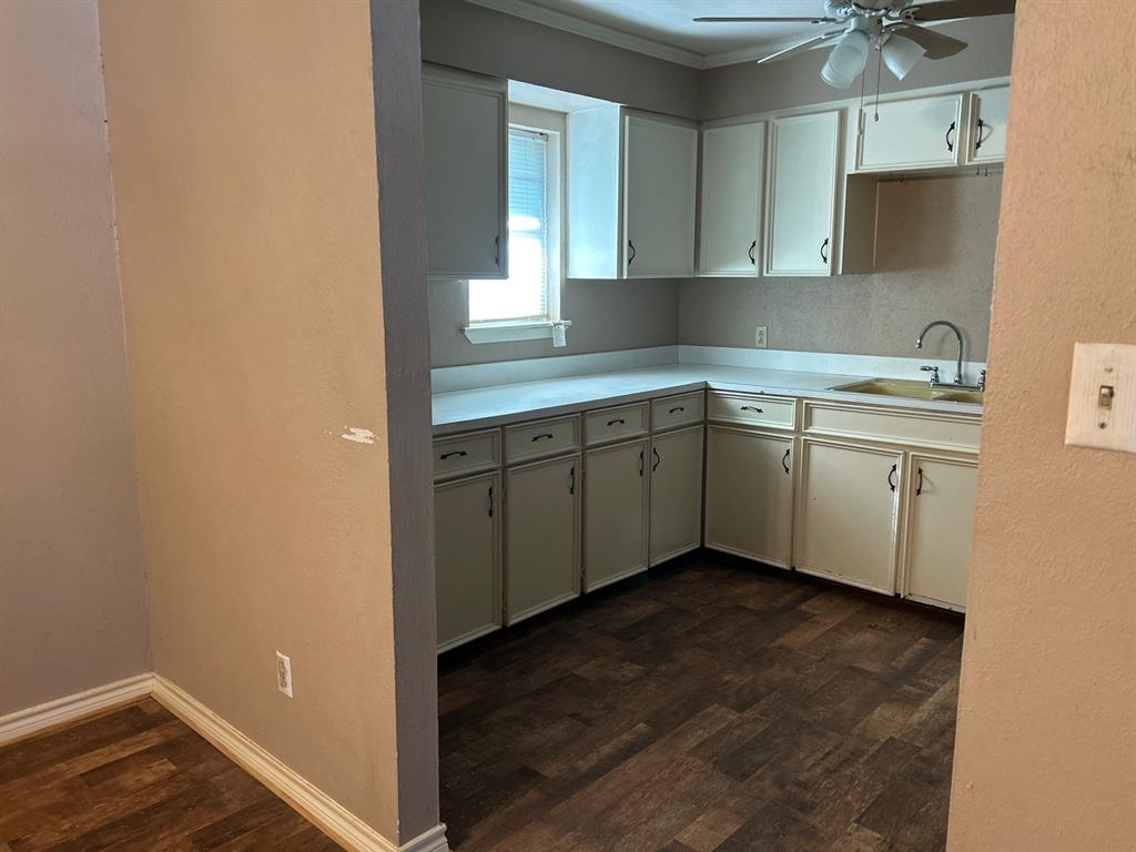928 Vz County Road 3828 Wills Point, TX 75169 - Photo 9 of 29 a view of cabinets a sink and a window in a room