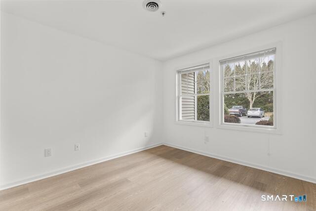 468 Main Street, Unit 111 East Lyme, CT 06357 - Photo 13 of 25 an empty room with a window